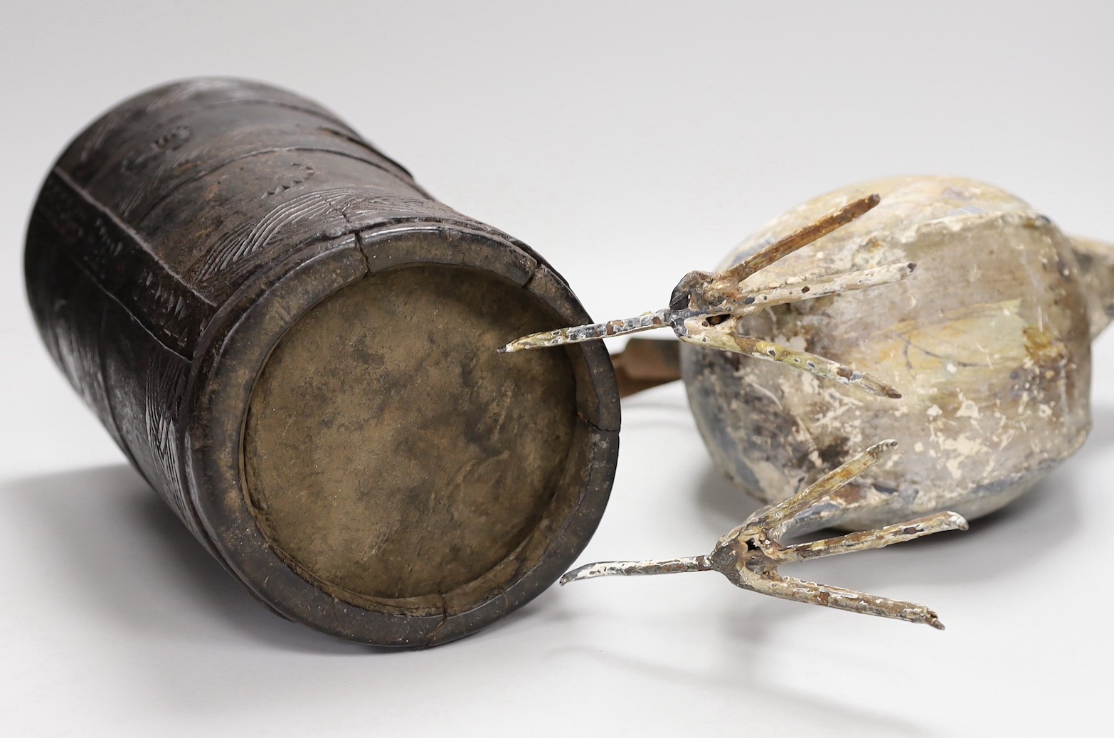 An 18th century Scandinavian carved wood tankard and a 19th century painted tin plated iron model of a cockerel, 36.5cm high.